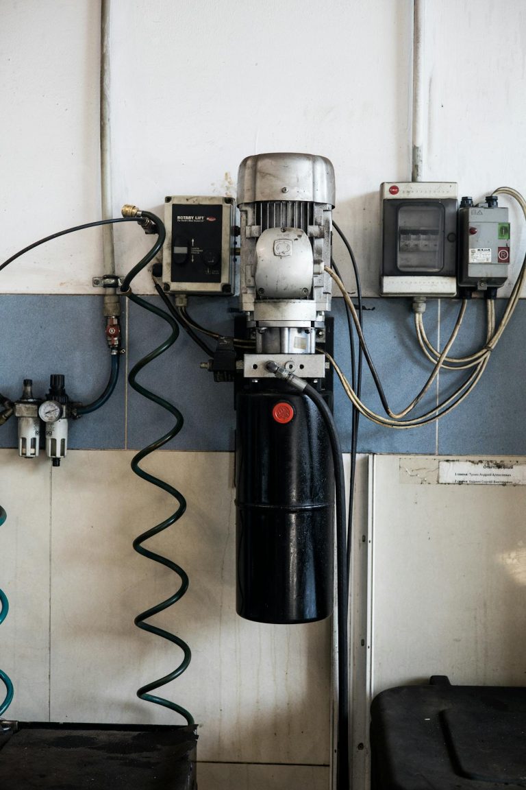 Close-up of machinery and electrical components in a repair workshop.